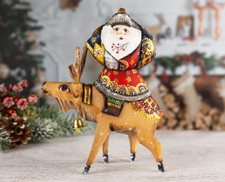 Hand-carved Santa Claus figurine on the reindeer