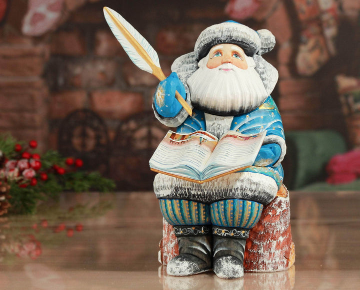 Hand Carved Santa Claus with the book Santa blue